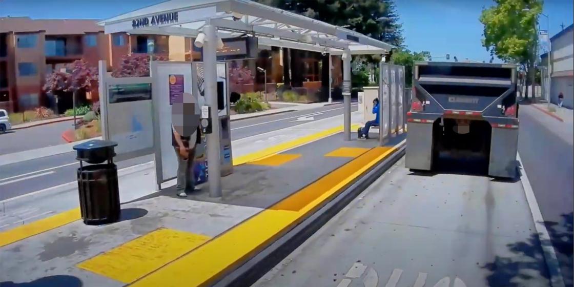 Dump truck drives through bus only lane