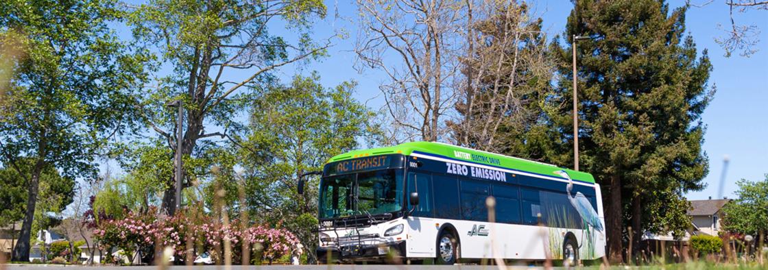 Zero Emission Bus Outside by grass and trees